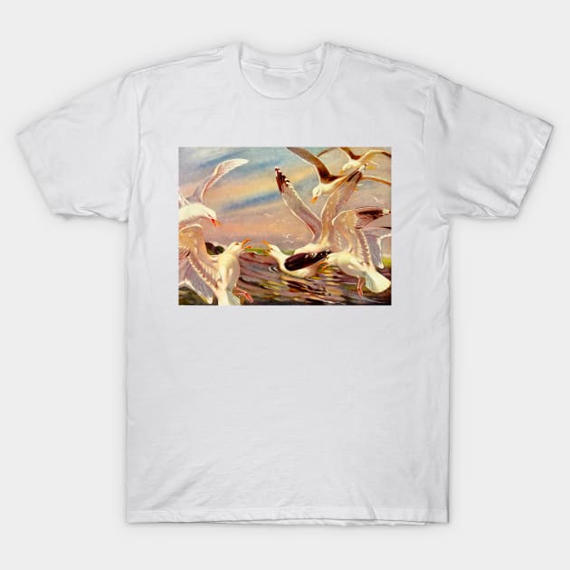 Seagulls in flock over the sea T-Shirt by Marccelus